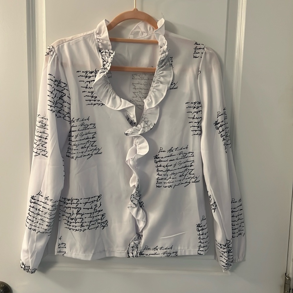 White blouse ruffle trim  with graffiti writing